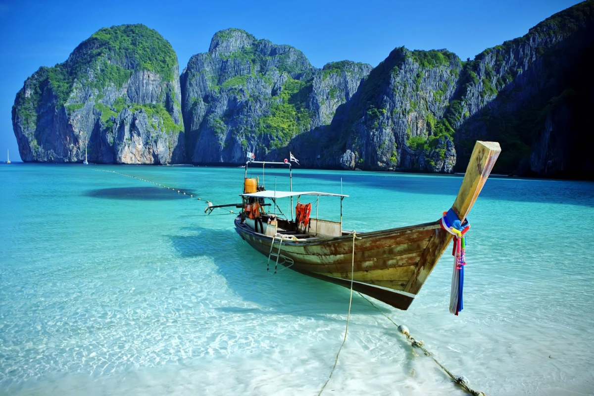 Boats floating near scenic Thai islands with crystal-clear waters